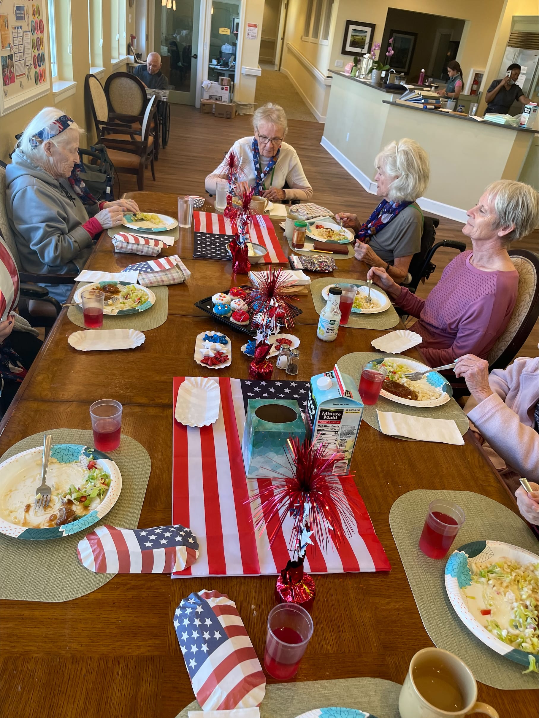 Longhouse residents sharing a meal at the dining table
